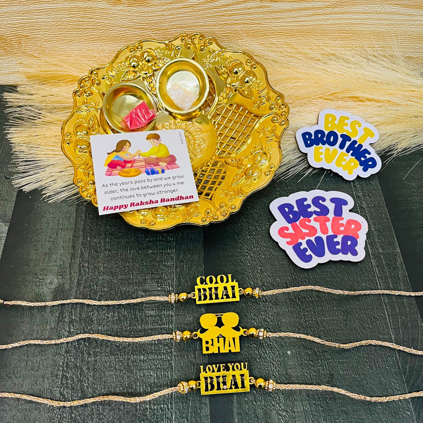 Trendy Rakhi Set with  Plate, Roli Moli, 3 Rakhis, Greeting Card, and 2 Fridge Magnets