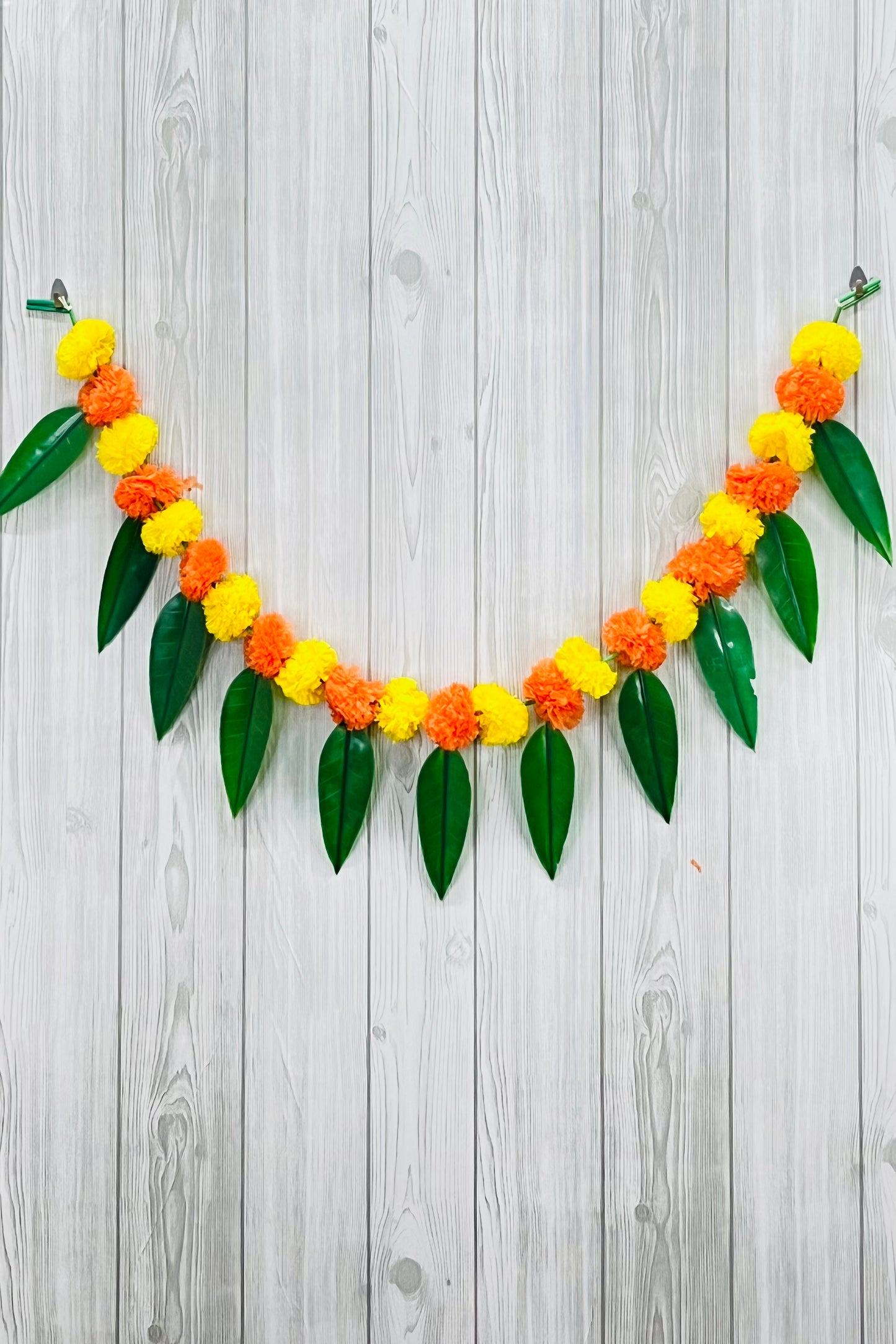 Akaar Festive Bandhanwar in marigold with mango leaves