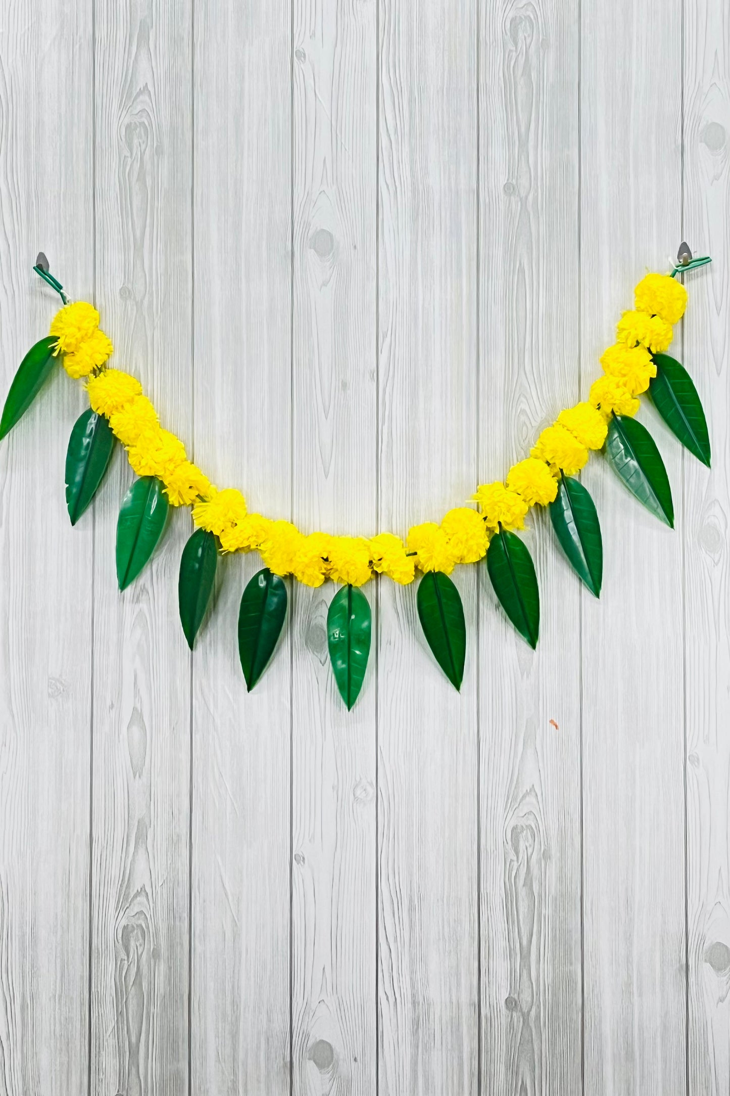 Akaar Festive Bandhanwar in marigold with mango leaves