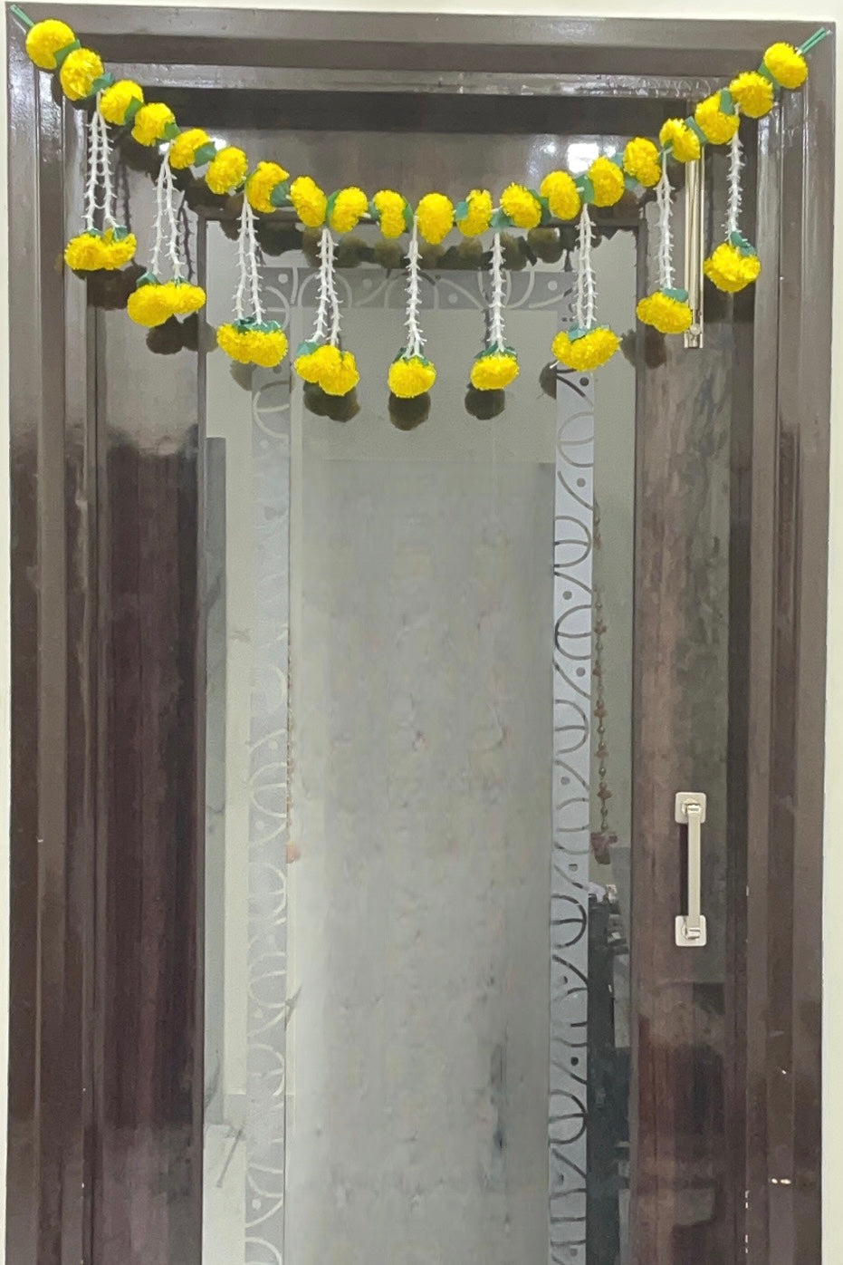 Akaar Festive Bandhanwar in marigold and rajnigandha jhumki