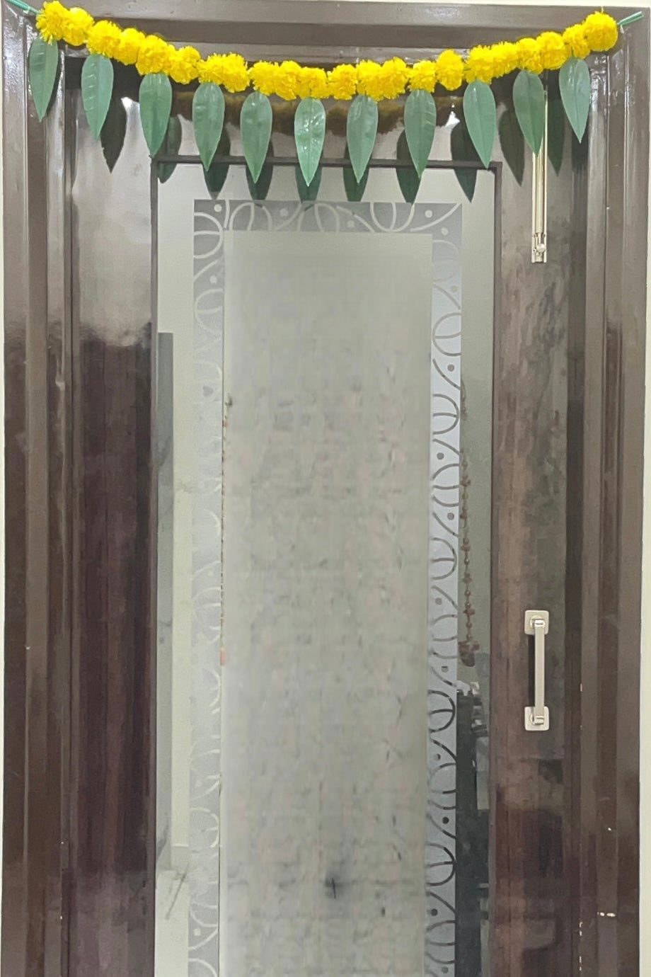 Akaar Festive Bandhanwar in marigold with mango leaves