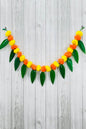 Akaar Festive Bandhanwar in marigold with mango leaves